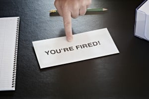 Can You Get Terminated When Receiving Workers’ Comp? 1 finger pointing at letter on office desk