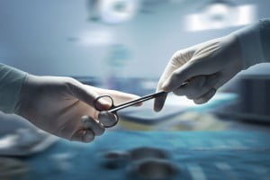 When a Workplace Injury Leads to Surgery 1 surgicalglovesandclamp e1467996793468