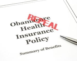 Obamacare government health care insurance program policy with a pen ready to be signed.
