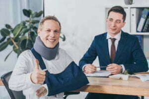 businessman sitting at table wile worker in neck b 2022 02 05 03 37 18 utc 1