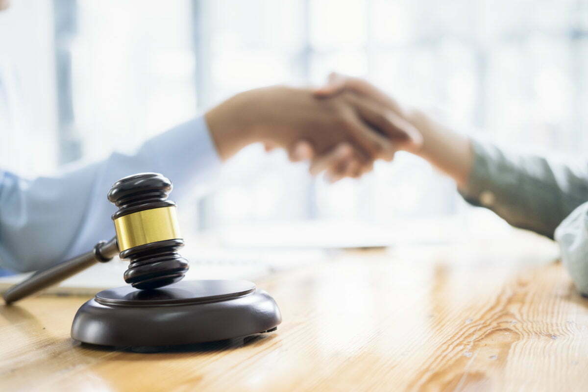 How to Negotiate a Settlement in Workers' Compensation Claims 1 lawyer and attorney having team meeting at law fir 2022 02 03 00 26 06 utc