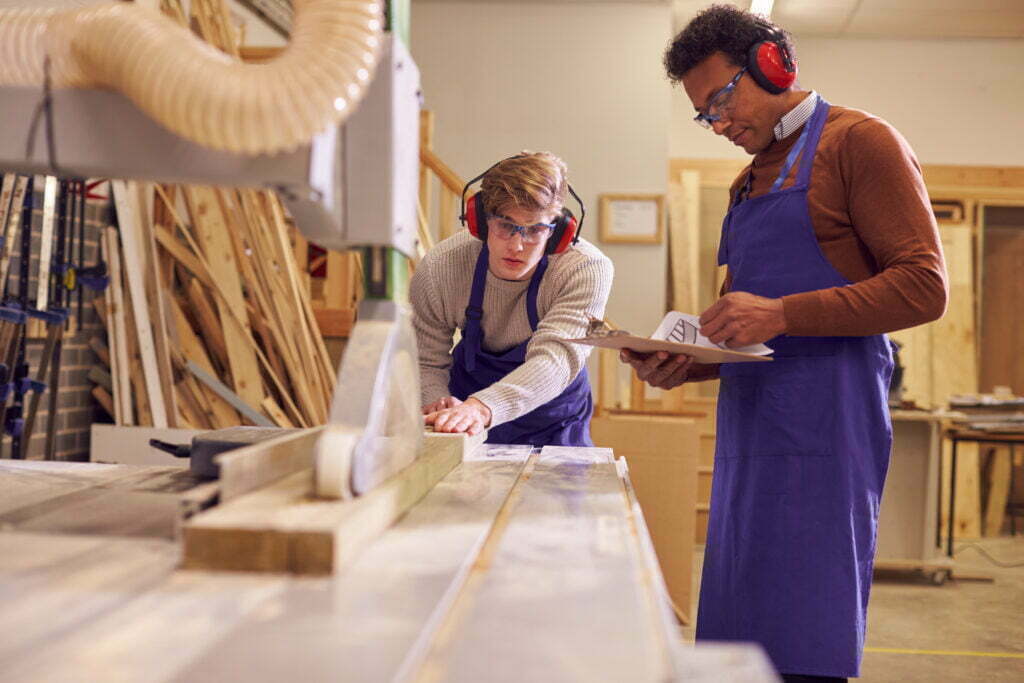 tutor with male carpentry student in workshop stud 2022 02 02 04 52 24 utc