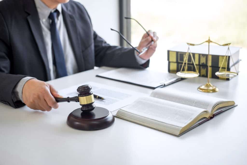 What If The Insurance Carrier Is Not Paying You the Correct Amount? 2 judge gavel with justice lawyers businessman in s 2022 11 15 15 31 54 utc