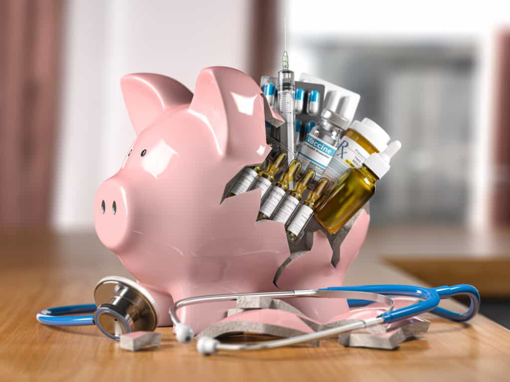 piggy bank with stethoscope meds pills and vacci 2022 02 07 10 21 10 utc