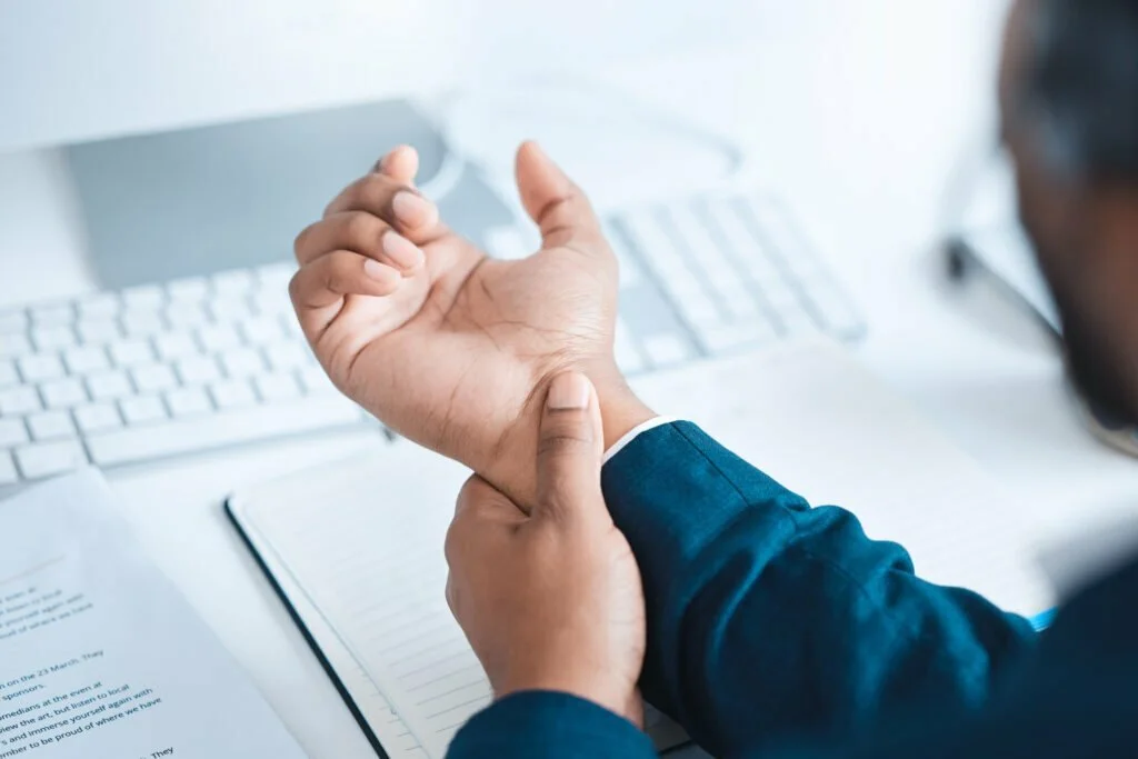 So, You’ve Been Hurt at Work. Now What? 2 hands of business man with pain carpal tunnel syn 2022 12 16 15 32 14 utc