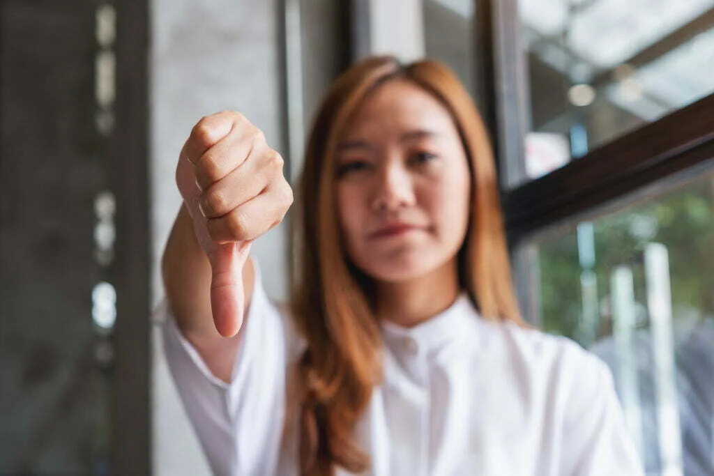 Understanding Your Rights When You Have a Nurse Case Manager 3 a young woman making thumbs down hands sign 2022 12 16 05 03 09 utc